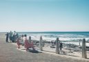 Cape Town beach with tourists enjoying seaside views